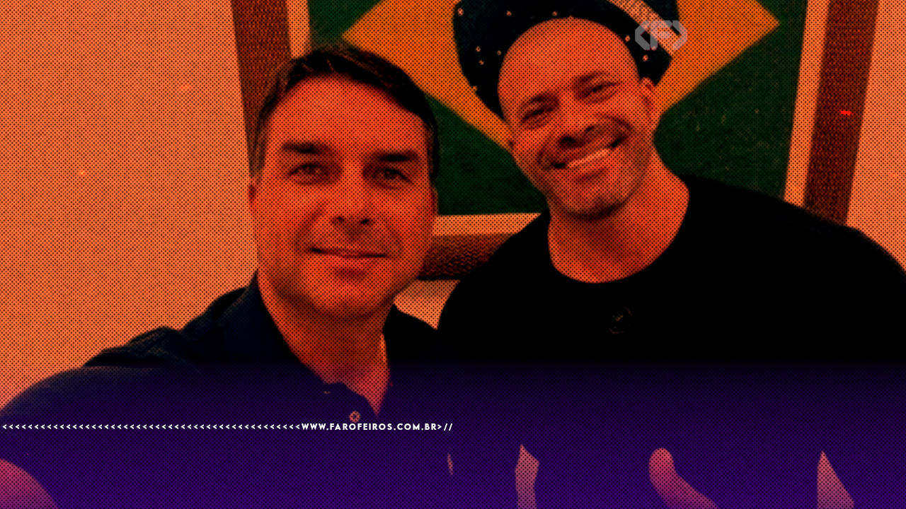 Selfie com filtro laranja e roxo mostrando Flávio Bolsonaro e Daniel Silveira juntos, sorrindo, com uma bandeira do Brasil ao fundo. Daniel Silveira usa camiseta preta e boné.